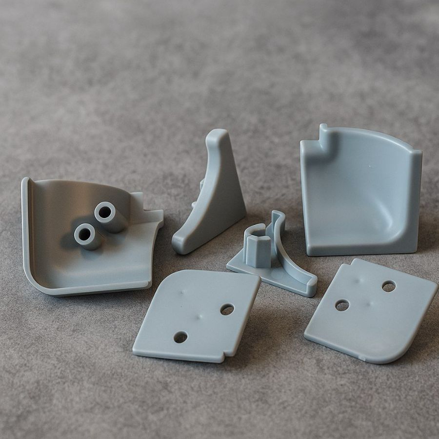 фото Комплект заглушек для вогнутого плинтуса ,серый (к алюм. и пласт.плинтусу)